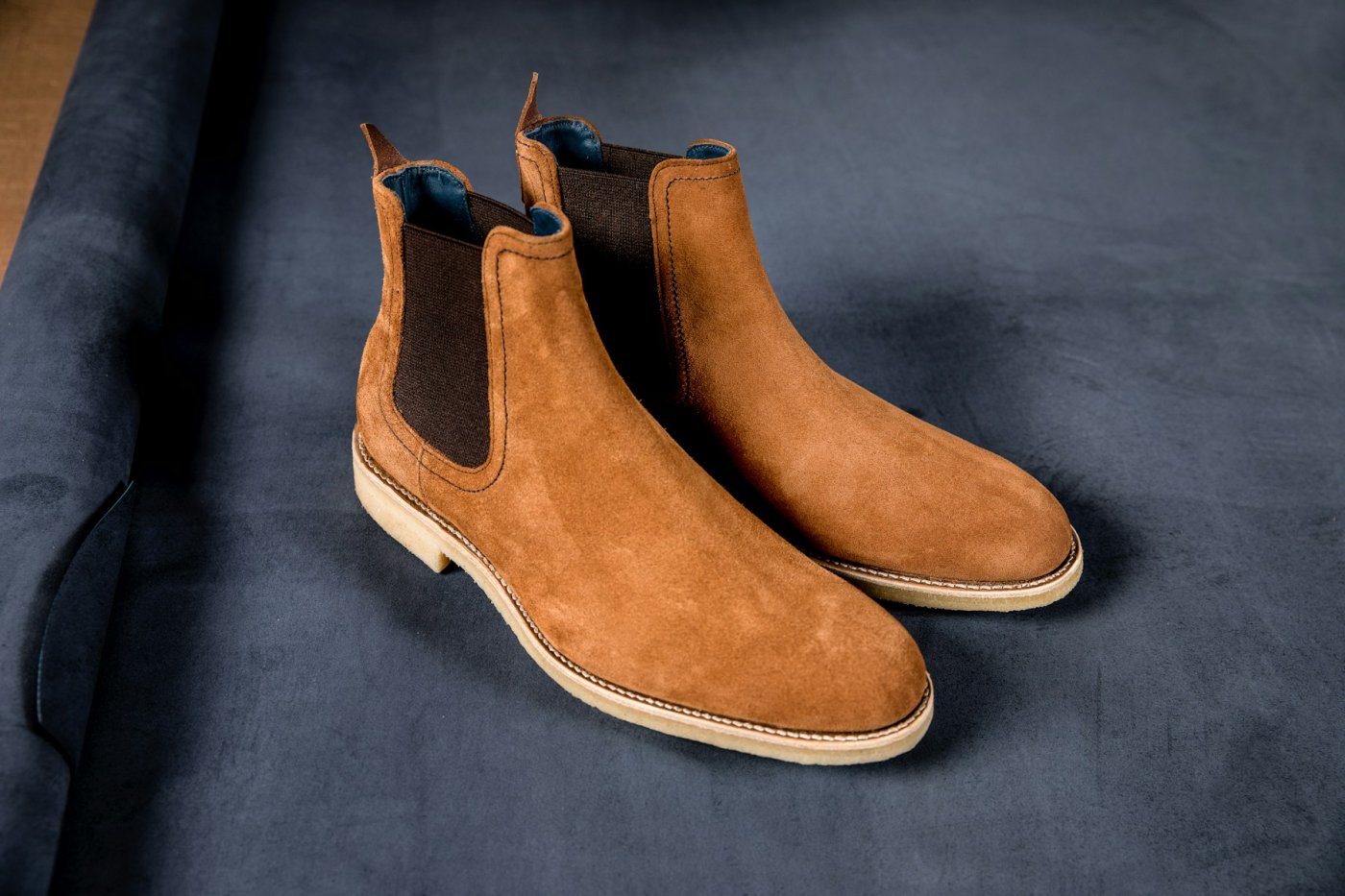 Tan suede Chelsea boots typical of export lots that stain when the nap stays damp